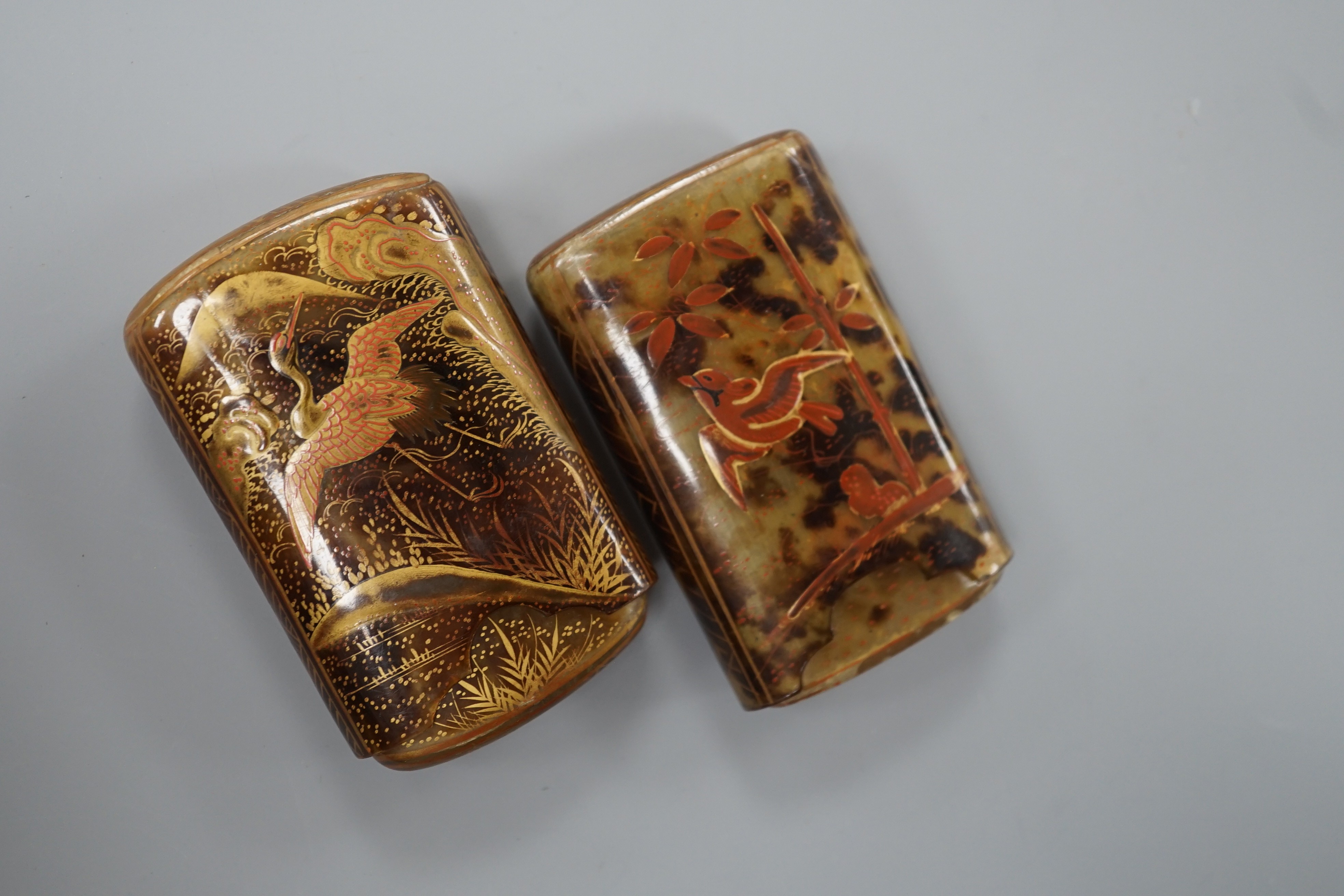 Two Japanese gilt lacquered tortoiseshell cigarette cases, 8 cm